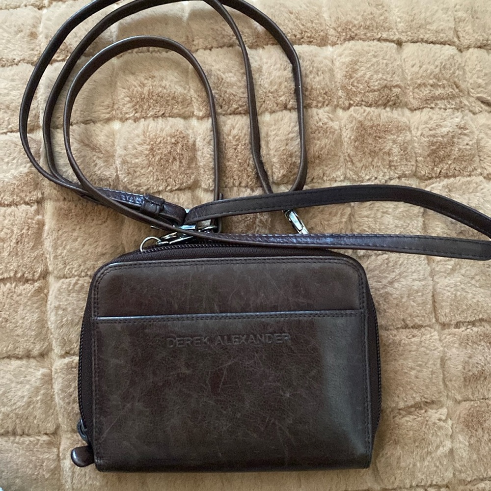 Derek Alexander leather wallet with shoulder strap.
